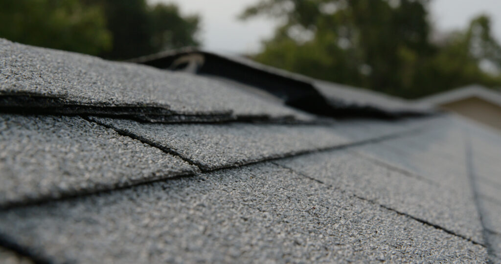Close view of a weathered asphalt shingle roof